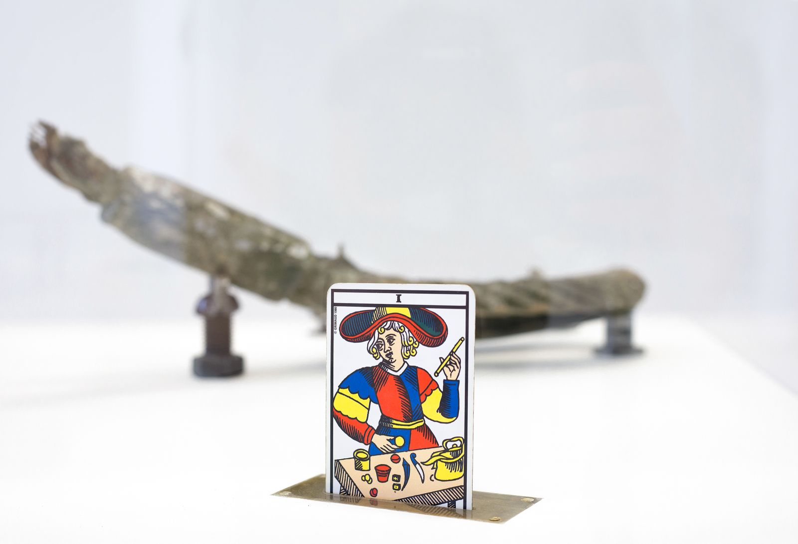 a tarot card coming out of a slot