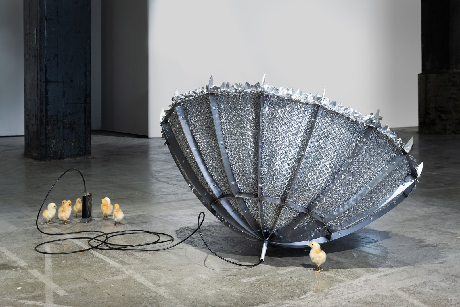 the back of a scalemail satelite dish in an industrial gallery space